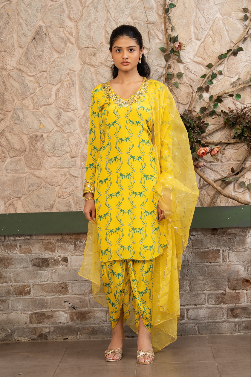 Woman wearing a yellow boho printed kurta set with dhoti pants and an organza dupatta in Senren's signature Bohemian print.