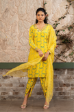 Woman wearing a yellow boho printed kurta set with dhoti pants and an organza dupatta in Senren's signature Bohemian print.