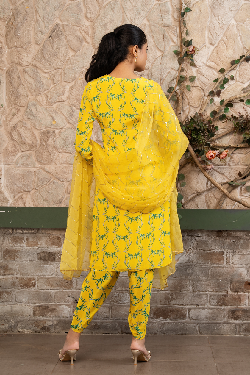 Woman wearing a yellow boho printed kurta set with dhoti pants and an organza dupatta in Senren's signature Bohemian print.