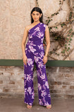 Woman wearing a purple floral printed one-shoulder draped co-ord set with wide-leg trousers by Senren.