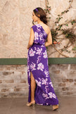 Model wearing a violet floral printed one-shoulder top with matching side slit maxi skirt, luxury designer co-ord set for women by Senren.