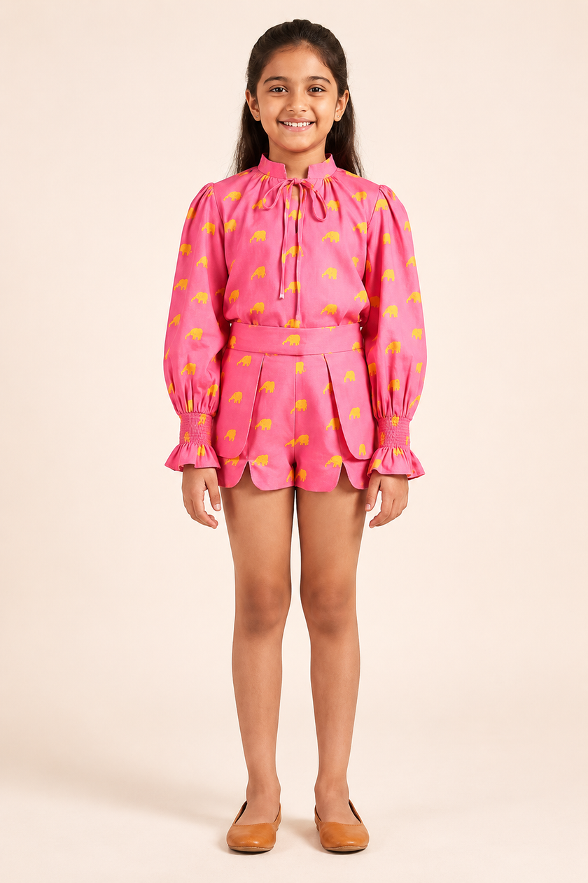 Pink printed top with structured tailored shorts.